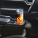 This photo shows the sunset beach tumbler placed in car cup holder for travel or errands

